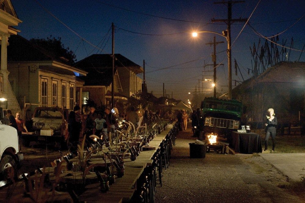 A dimly lit street scene of New Orleans