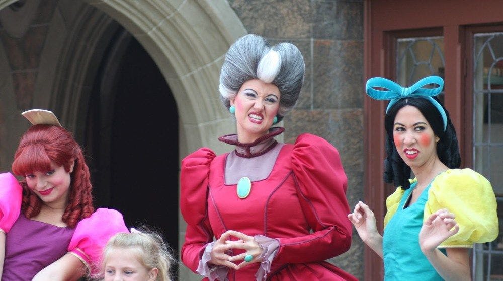 Women dressed as Cinderella's evil step mother and sisters Disneyland style.